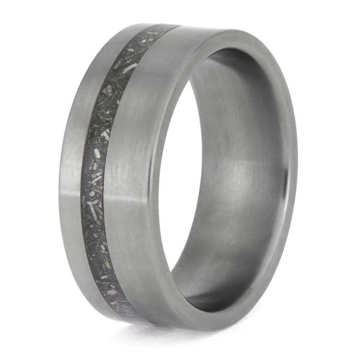 Silver ring with a textured band on a white background