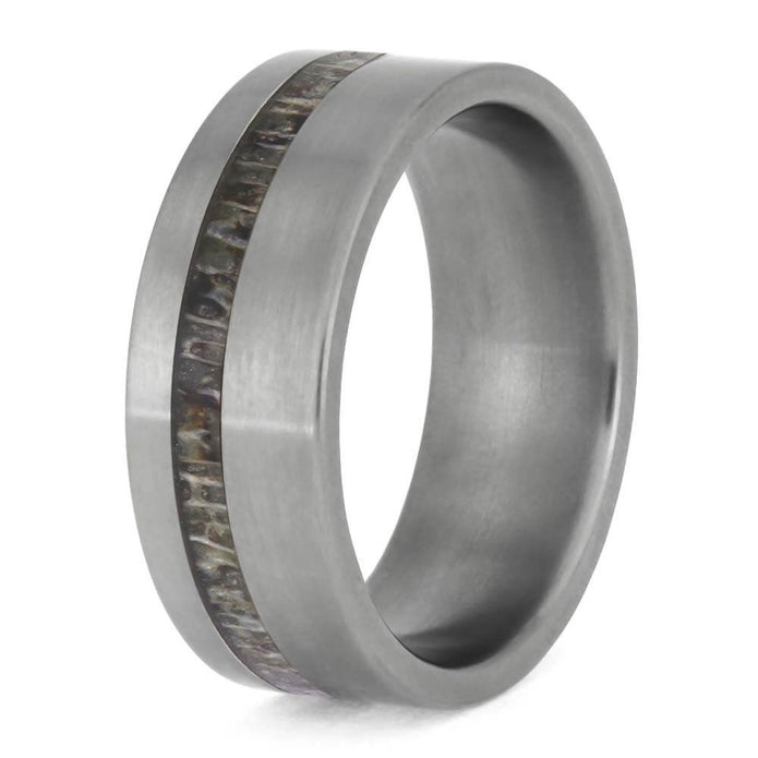 Silver ring with wooden inlay on a white background