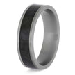 Silver ring with a black carbon fiber inlay on a white background