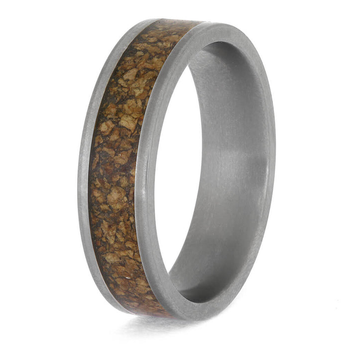 Ring with brown inlay and brushed metal finish on a white background