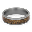 Ring with metallic band and cork inlay on a white background