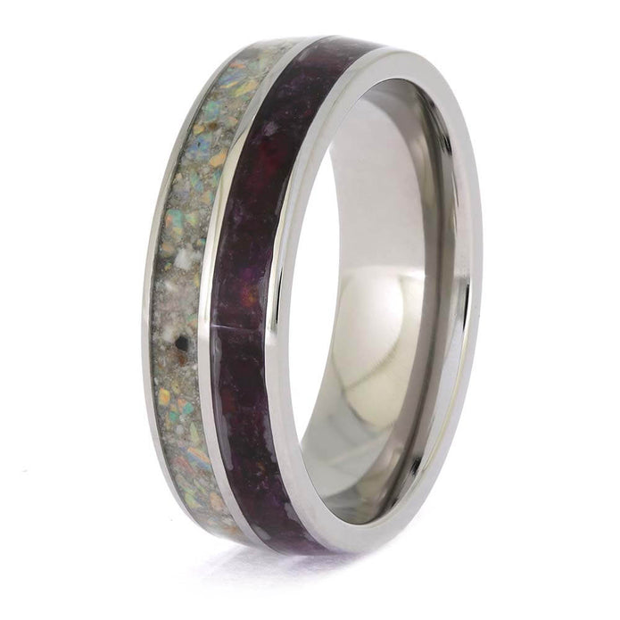 Silver ring with a colorful inlay on a white background