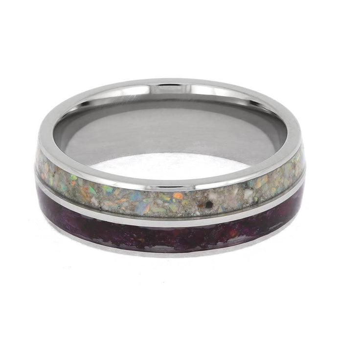 Silver ring with a colorful inlay on a white background