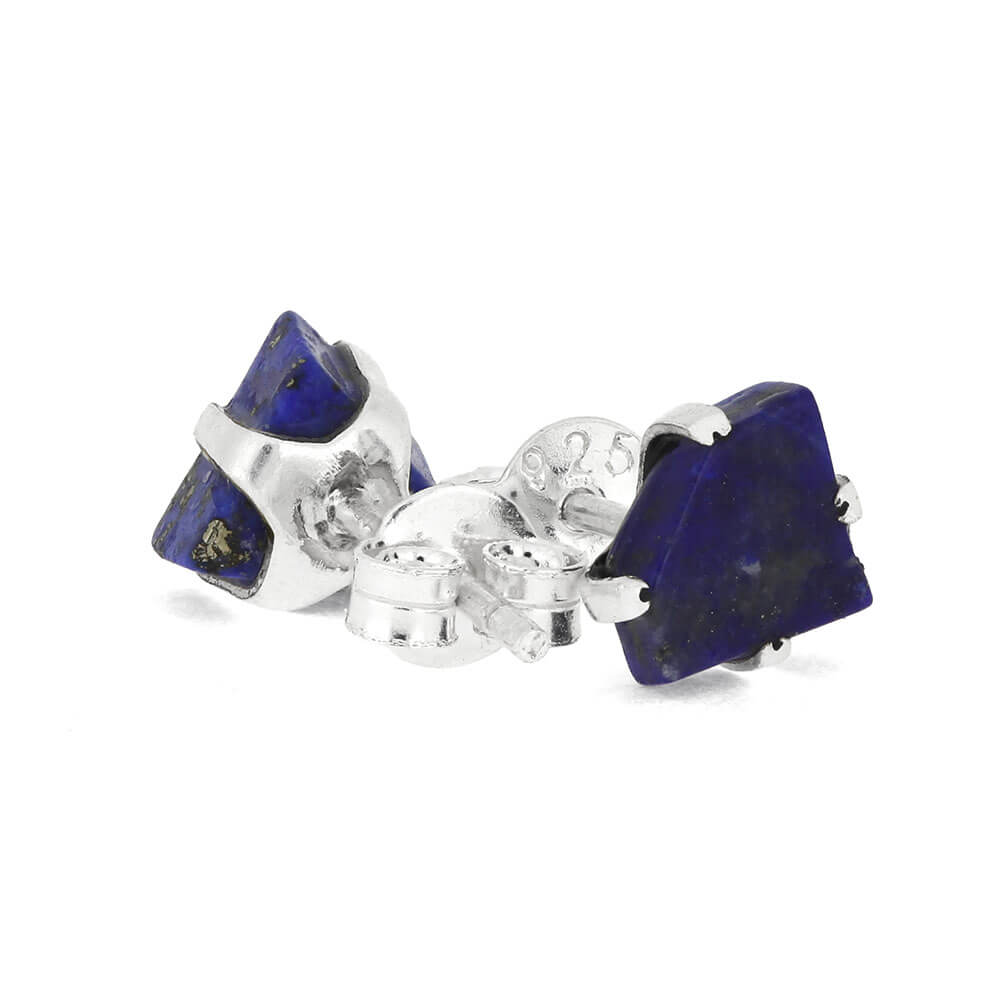 Pair of silver earrings with blue stone on a white background