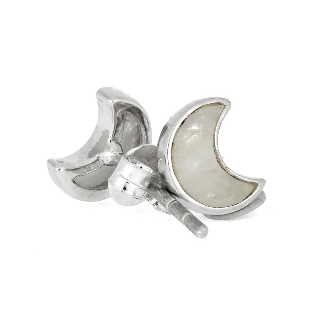 Silver moon-shaped earrings on a white background