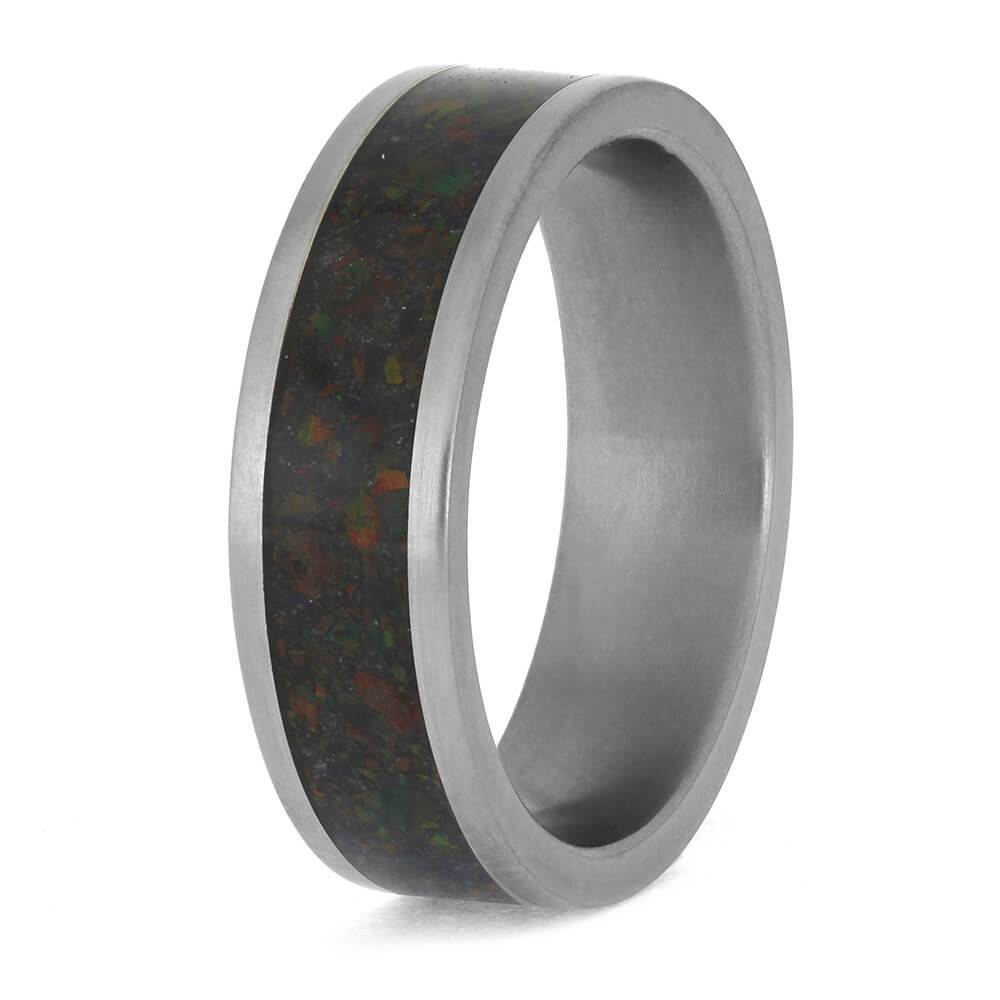Titanium wedding band featuring dark opal inlay