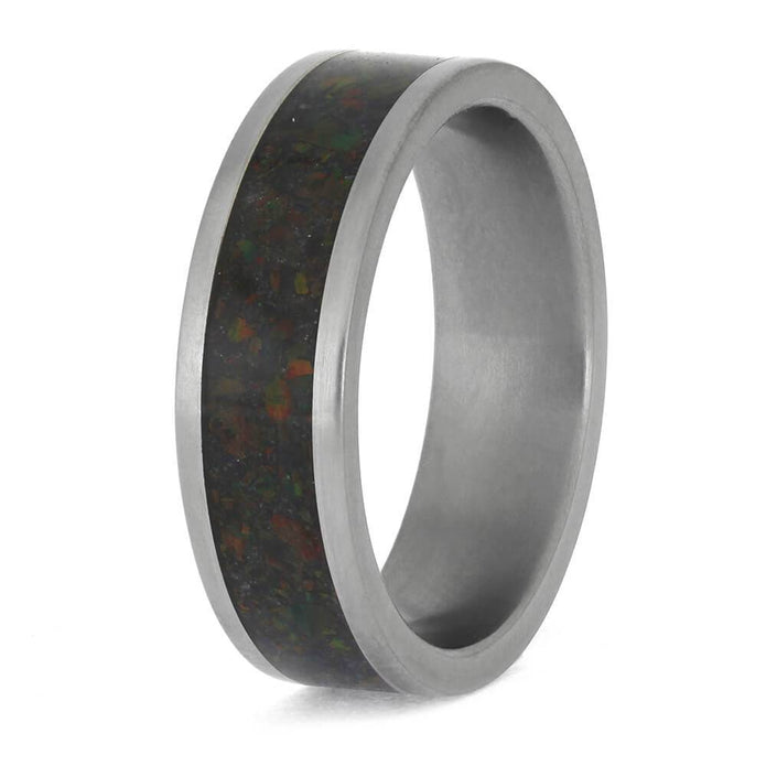Titanium wedding band featuring dark opal inlay