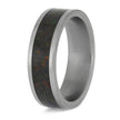 Titanium wedding band featuring dark opal inlay
