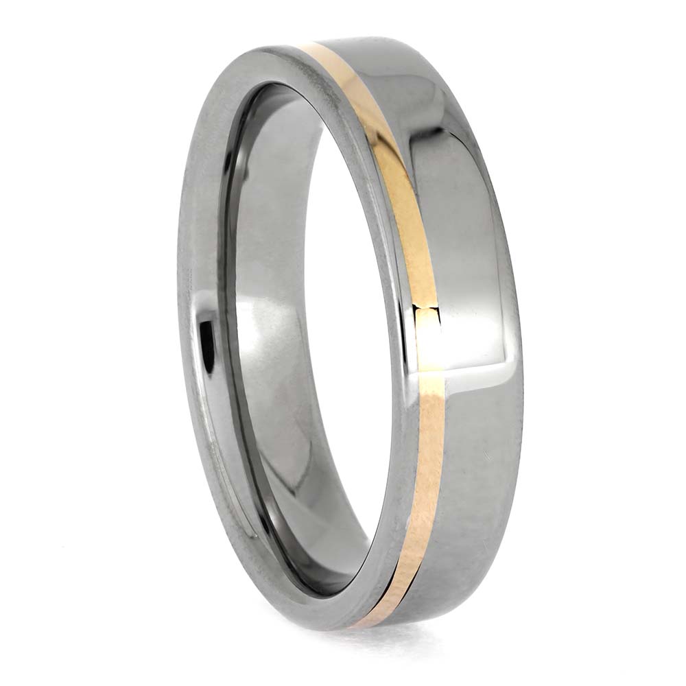 Silver ring with a gold stripe on a white background