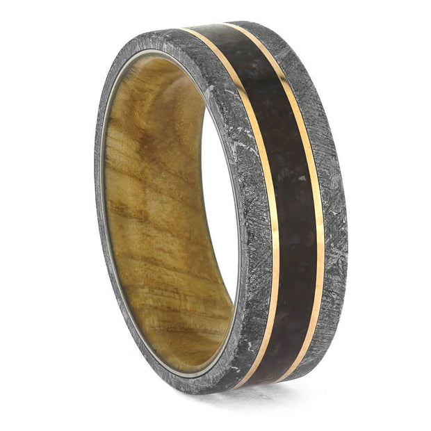 Wood-sleeved ring featuring dinosaur bone and Gibeon meteorite with rose gold pinstripes. Unique men's wedding band with ash burl wood interior.