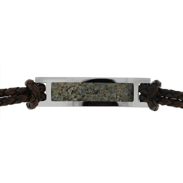 Close-up of dinosaur bone inlay on bracelet.