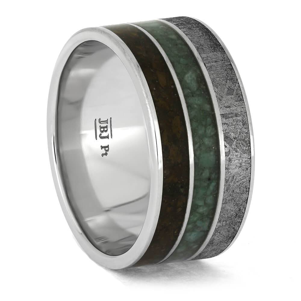 Platinum band with chrysocolla, meteorite, and dinosaur bone inlays.