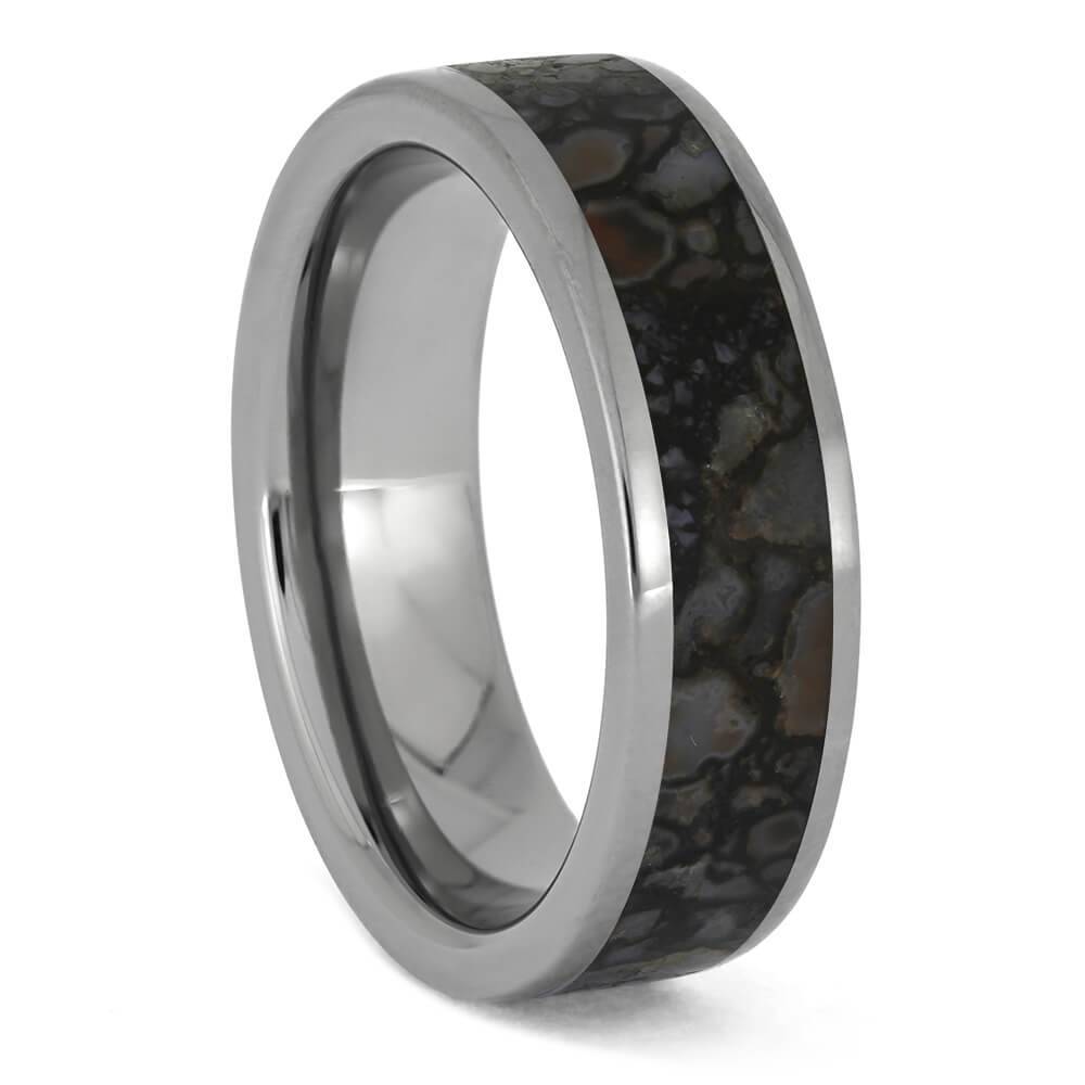 Unique dinosaur bone inlay ring in titanium