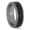 Flat-profile titanium ring featuring dinosaur bone