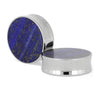 Titanium ear gauges with lapis lazuli inlays.