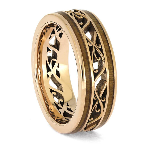 Rose gold ring with elegant filigree and wood inlays