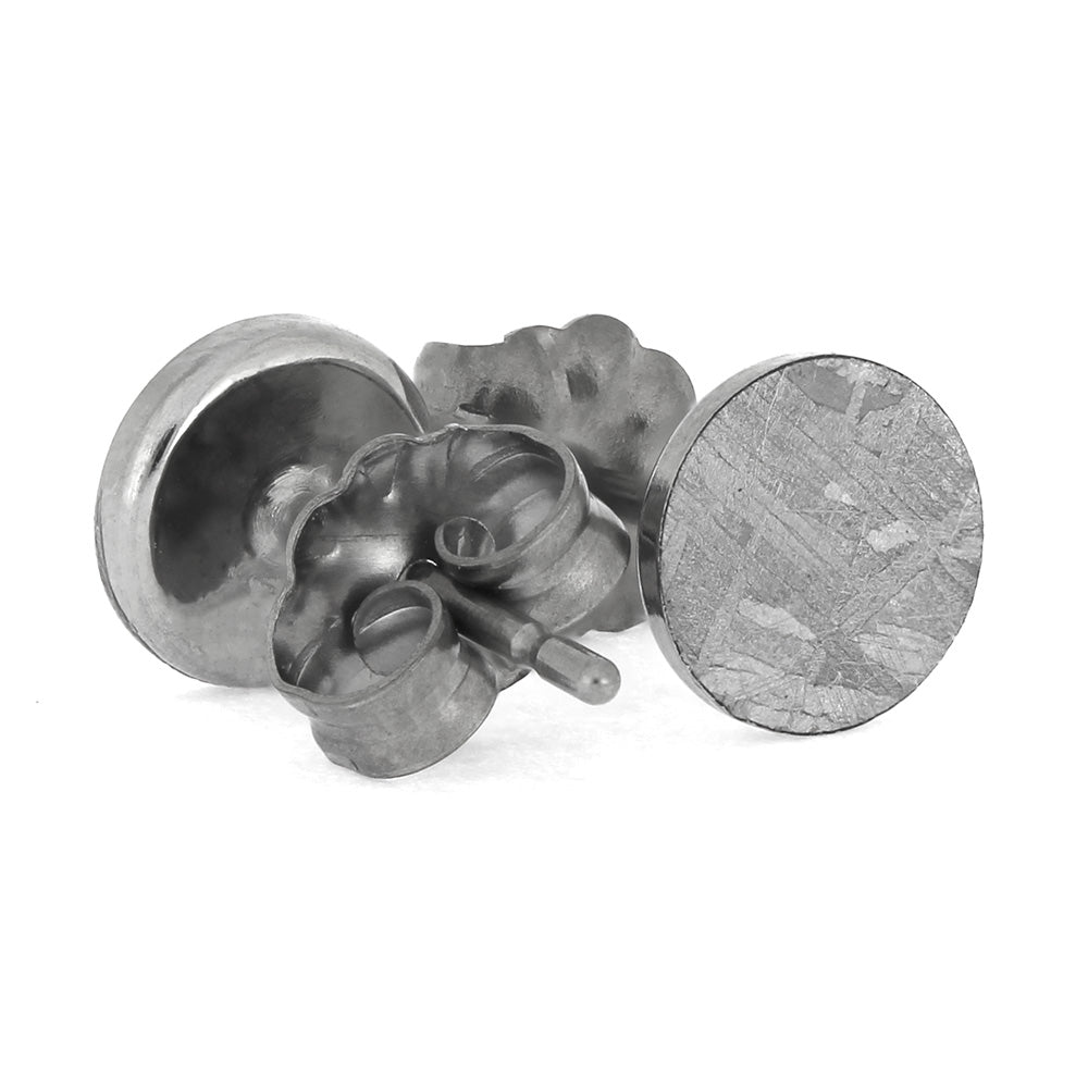 Silver earring on a white background