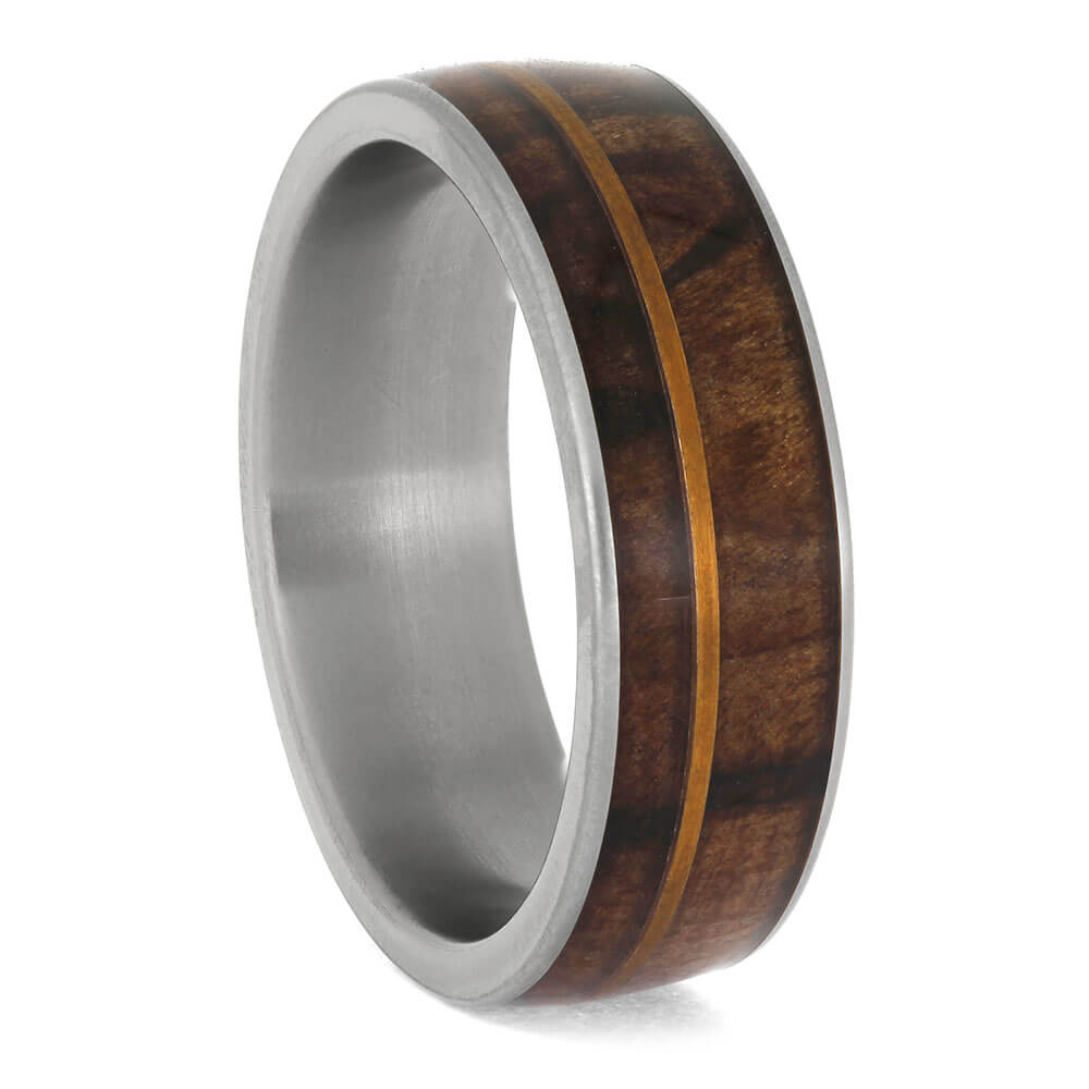 Ring with wooden inlay on a white background