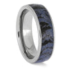 Silver ring with a blue and black patterned interior on a white background