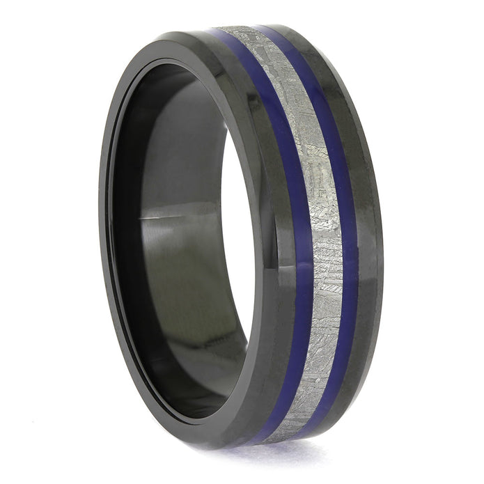 Ring with black exterior, blue interior, and silver inlay on a white background