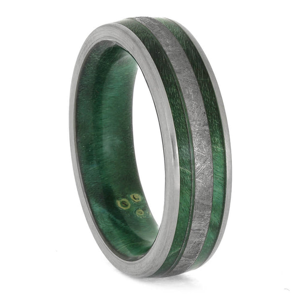 Green ring with metallic band on a white background