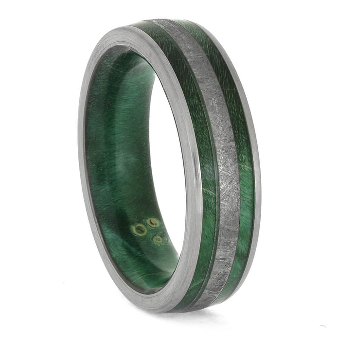Green ring with metallic band on a white background