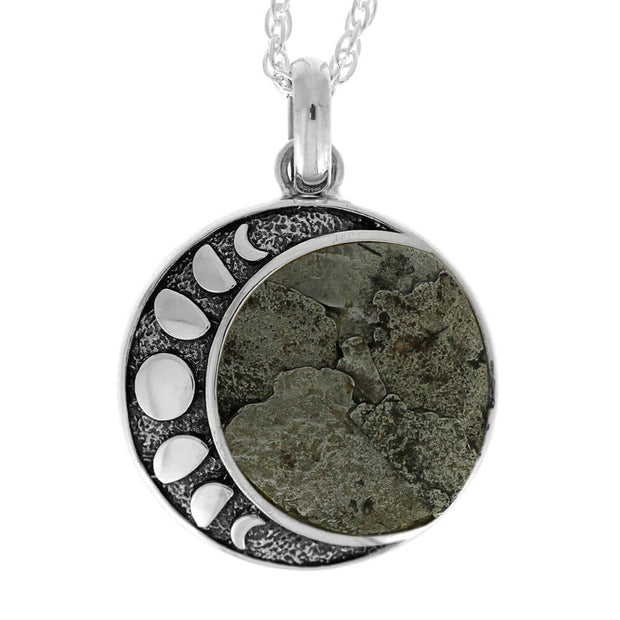 Close-up of moon phase necklace with meteorite inlay