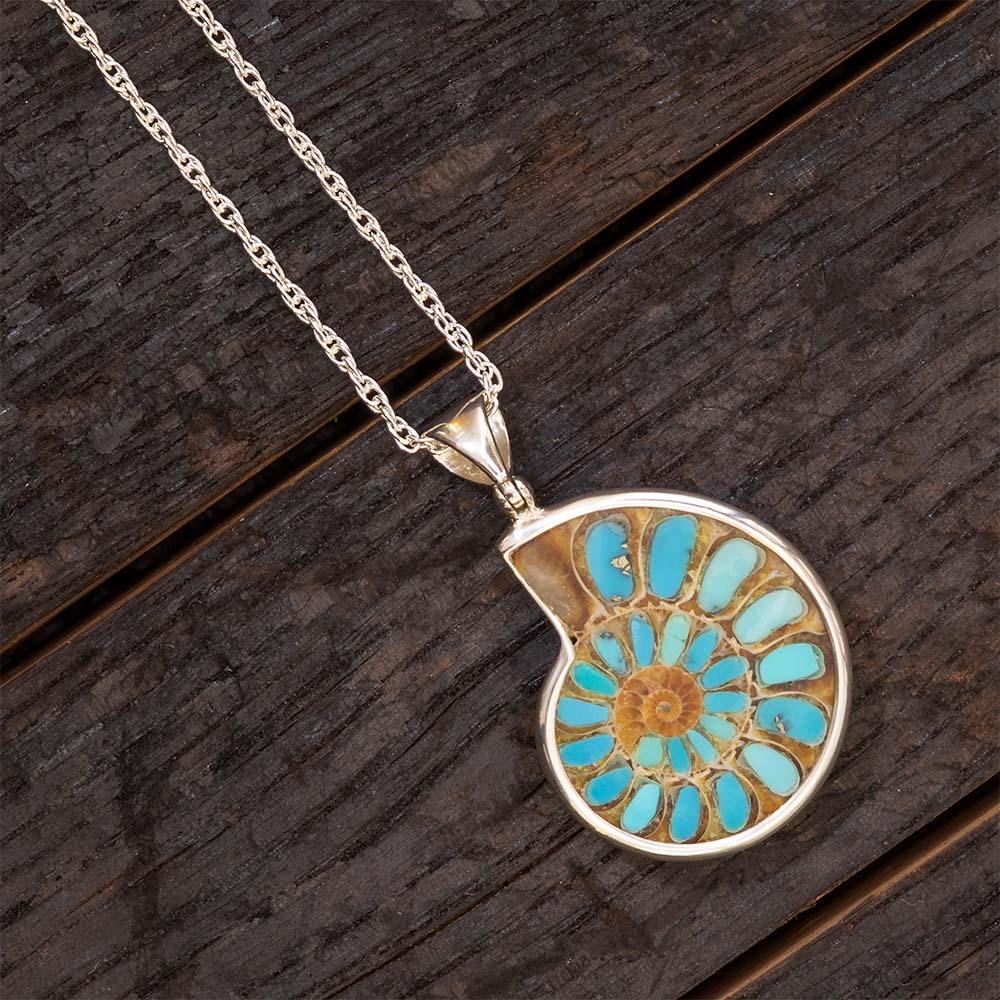 Necklace with a decorative pendant on a wooden surface