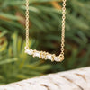 Elegant diamond bar necklace on display outdoors