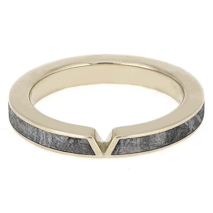 Gold ring with a gray wooden inlay on a white background