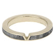 Gold ring with a gray wooden inlay on a white background