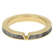 Gold ring with gray stone inlay on a white background