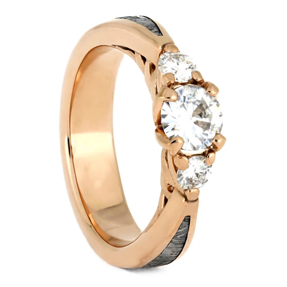 Rose gold custom engagement ring with three diamonds