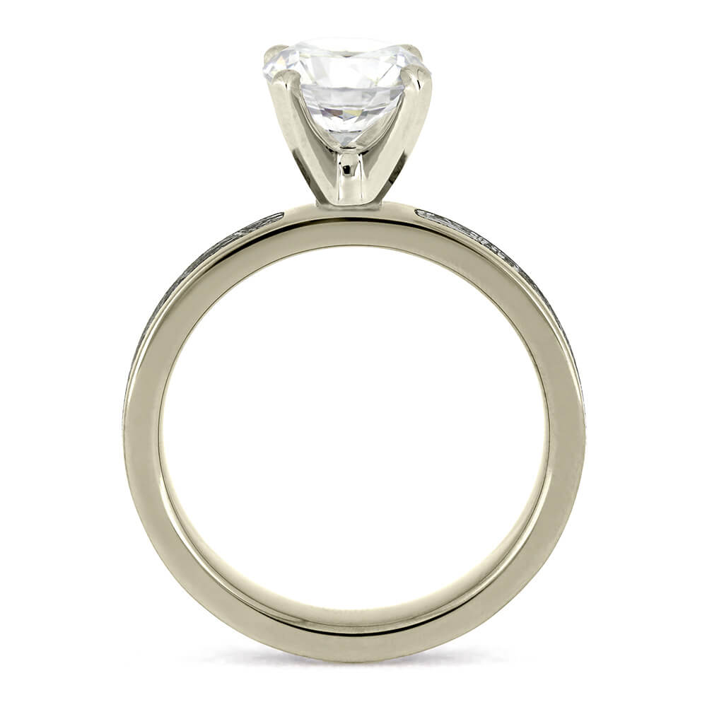 Elegant side profile of a 2.0-carat diamond ring with a prong setting and silver band.