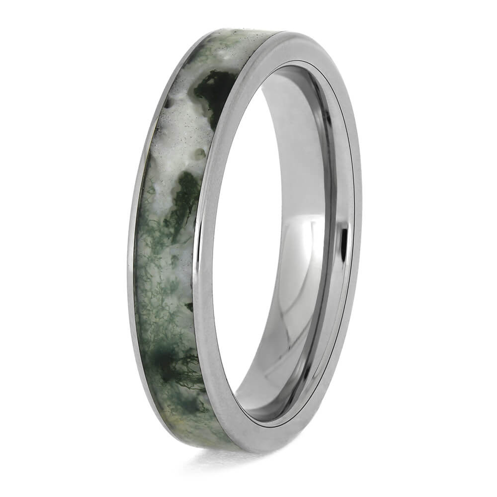 Angled view of moss agate titanium wedding ring