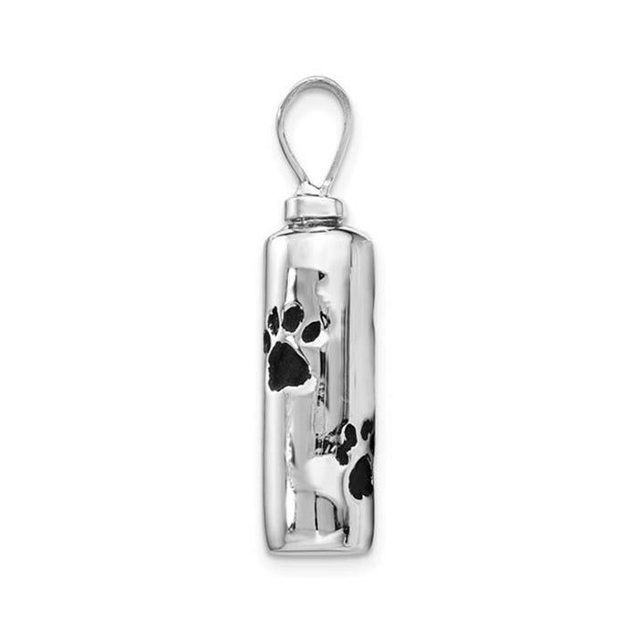 Silver pendant with black paw prints on a white background