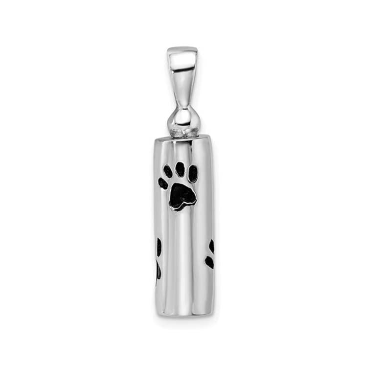 Silver pendant with a black paw print design on a white background