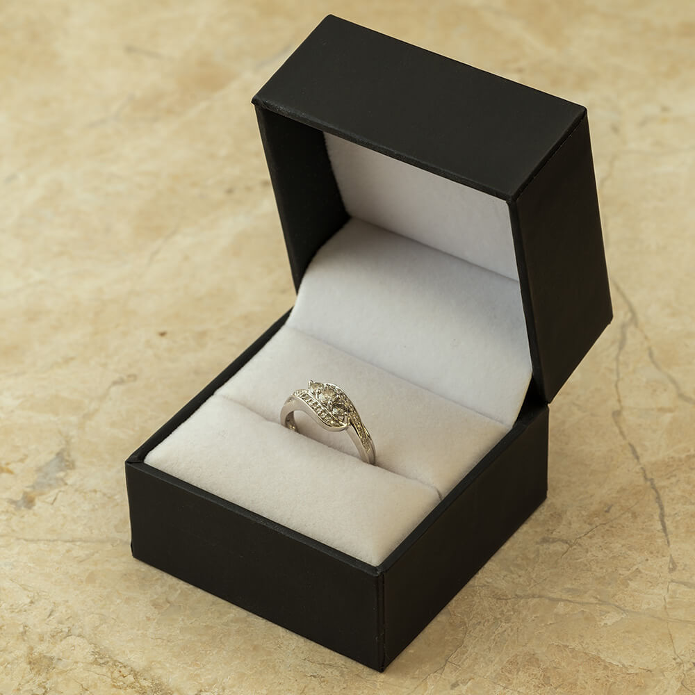 Unique Three Stone Diamond Engagement Ring With Swirled Band