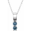 Silver necklace with a blue gemstone pendant on a white background