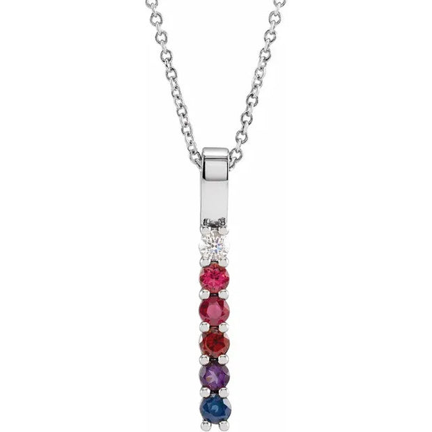 Necklace with a pendant featuring red and blue gemstones on a white background