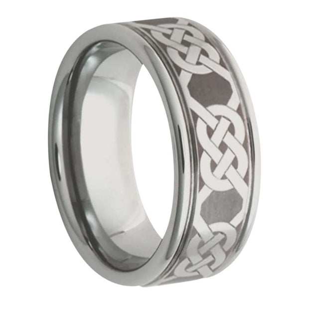 Silver ring with Celtic knot design on a white background