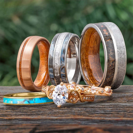 Assorted unique handcrafted rings by Jewelry by Johan arranged together.