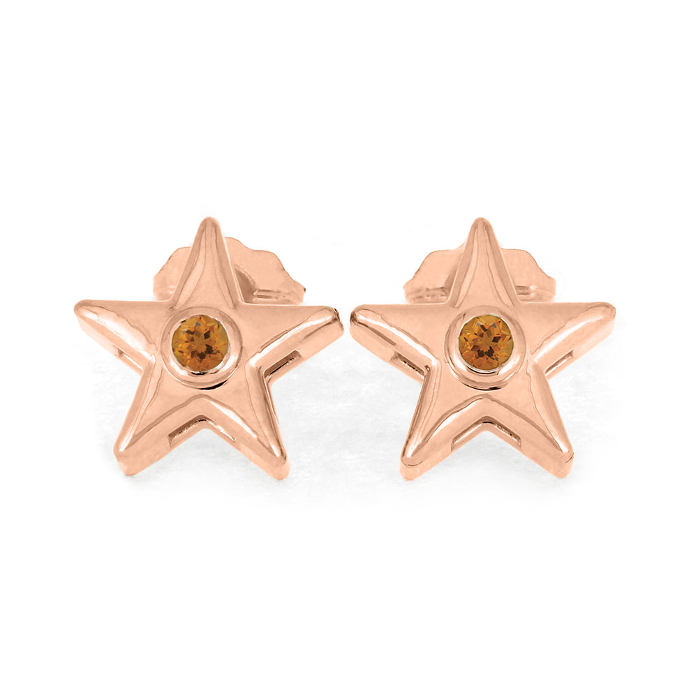Rose gold star stud earrings with orange birthstone