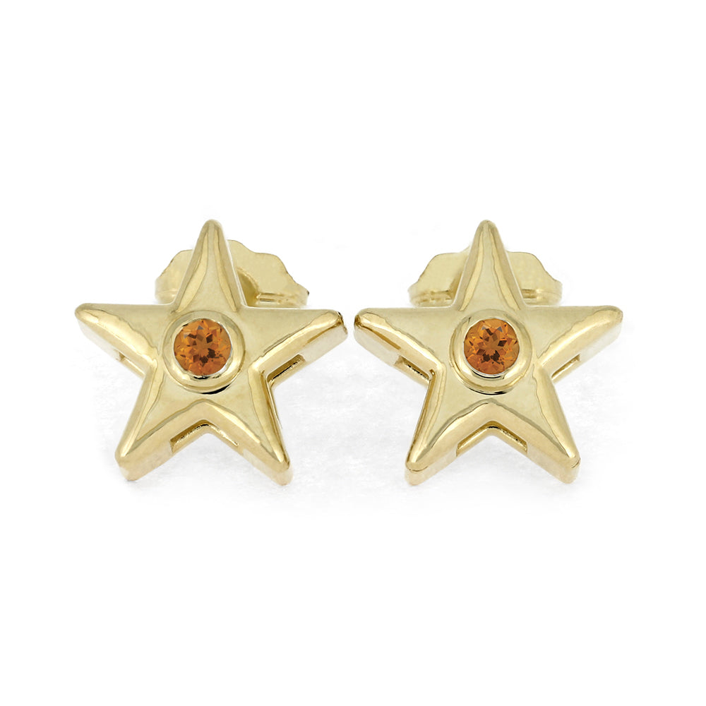Gold star stud earrings with orange birthstone on white background