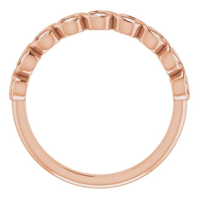 Side view of rose gold diamond band with bezel setting