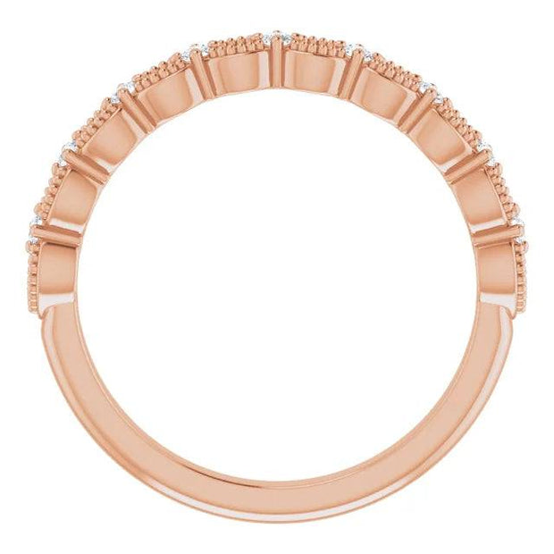 Side view of rose gold diamond band with milgrain design