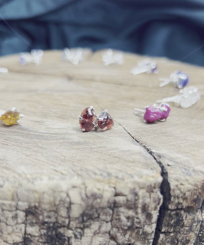 Collection of birthstone stud earrings on display