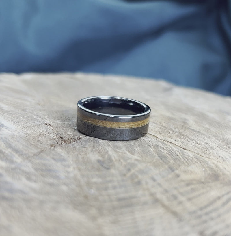 Stylish whiskey barrel oak men's band on wood surface