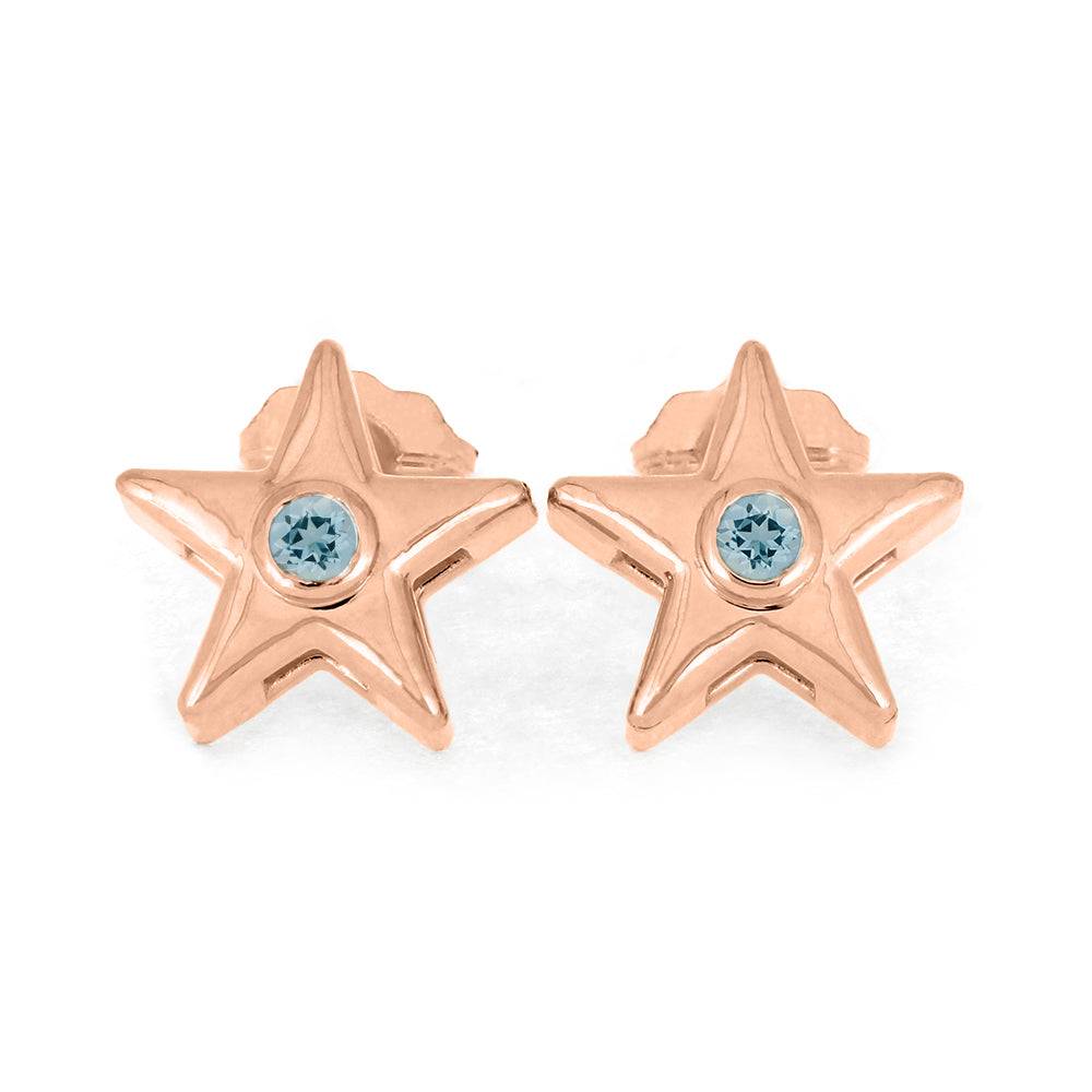 Rose gold star stud earrings with light blue birthstone