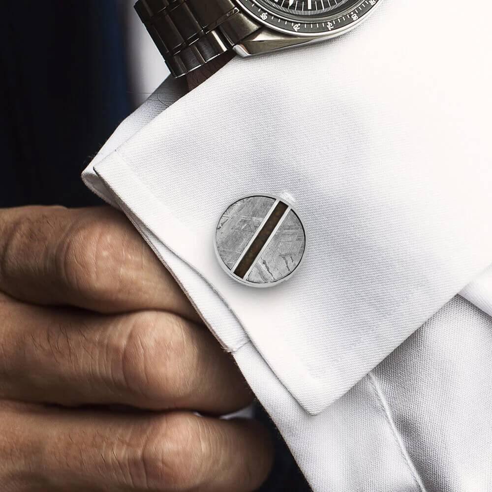 Meteorite and dinosaur bone cuff link on white shirt